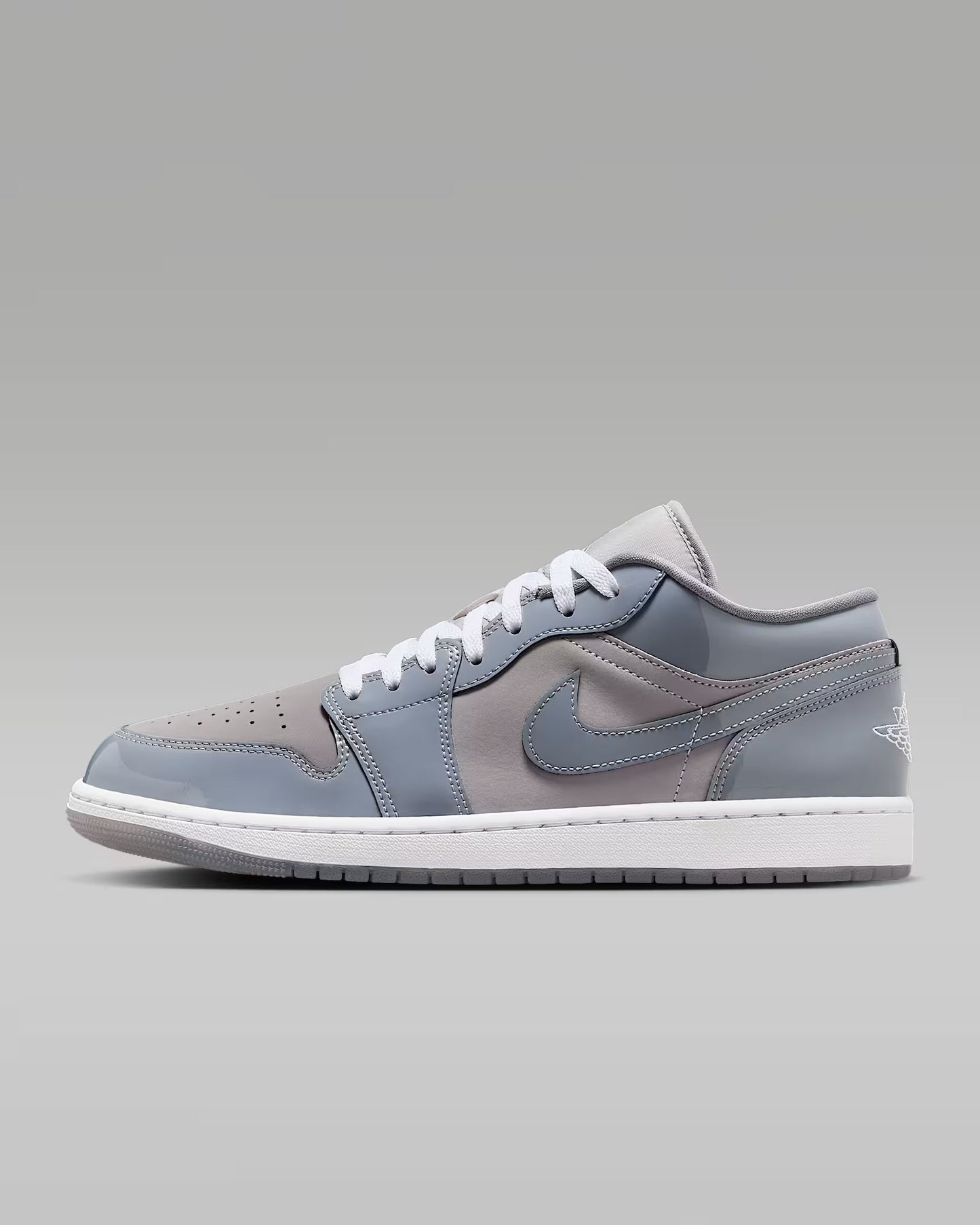 A pair of Nike Air Jordan 1 Low SE sneakers with a gray color scheme.