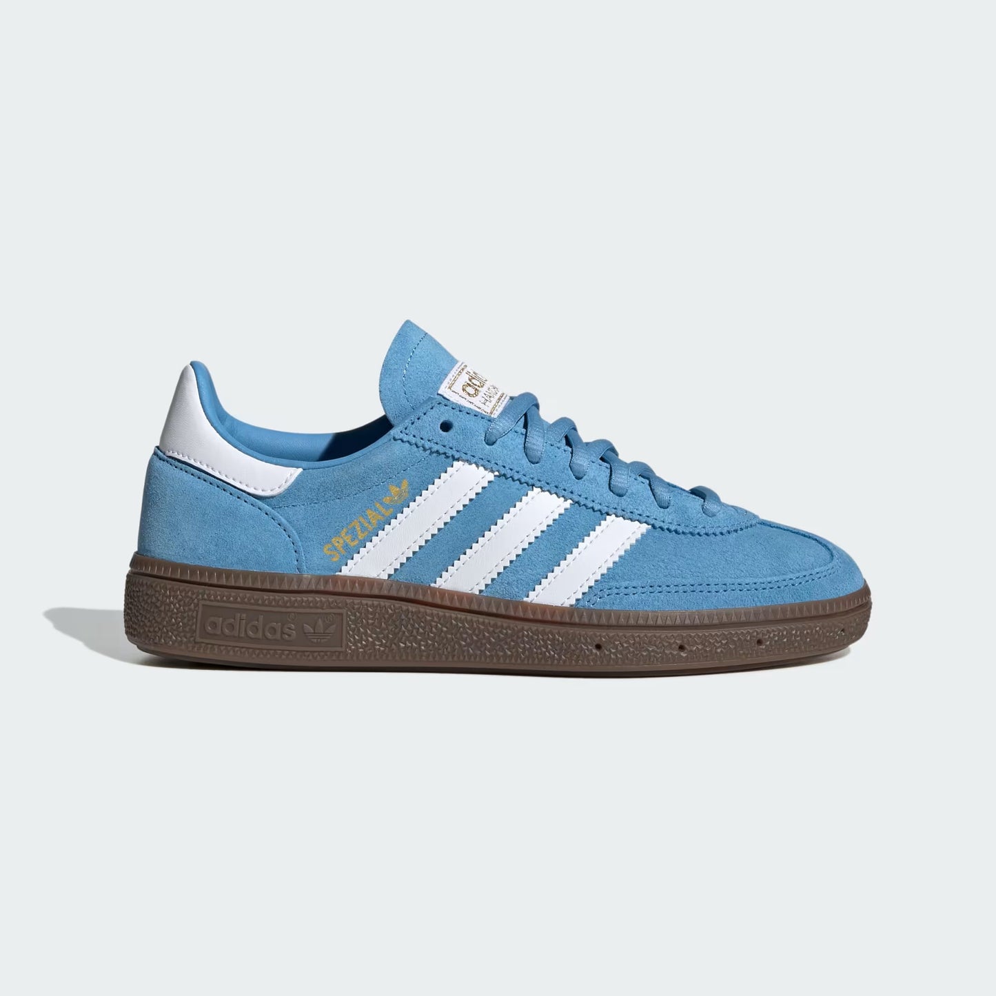 Blue Adidas sneaker with white stripes on a light gray background