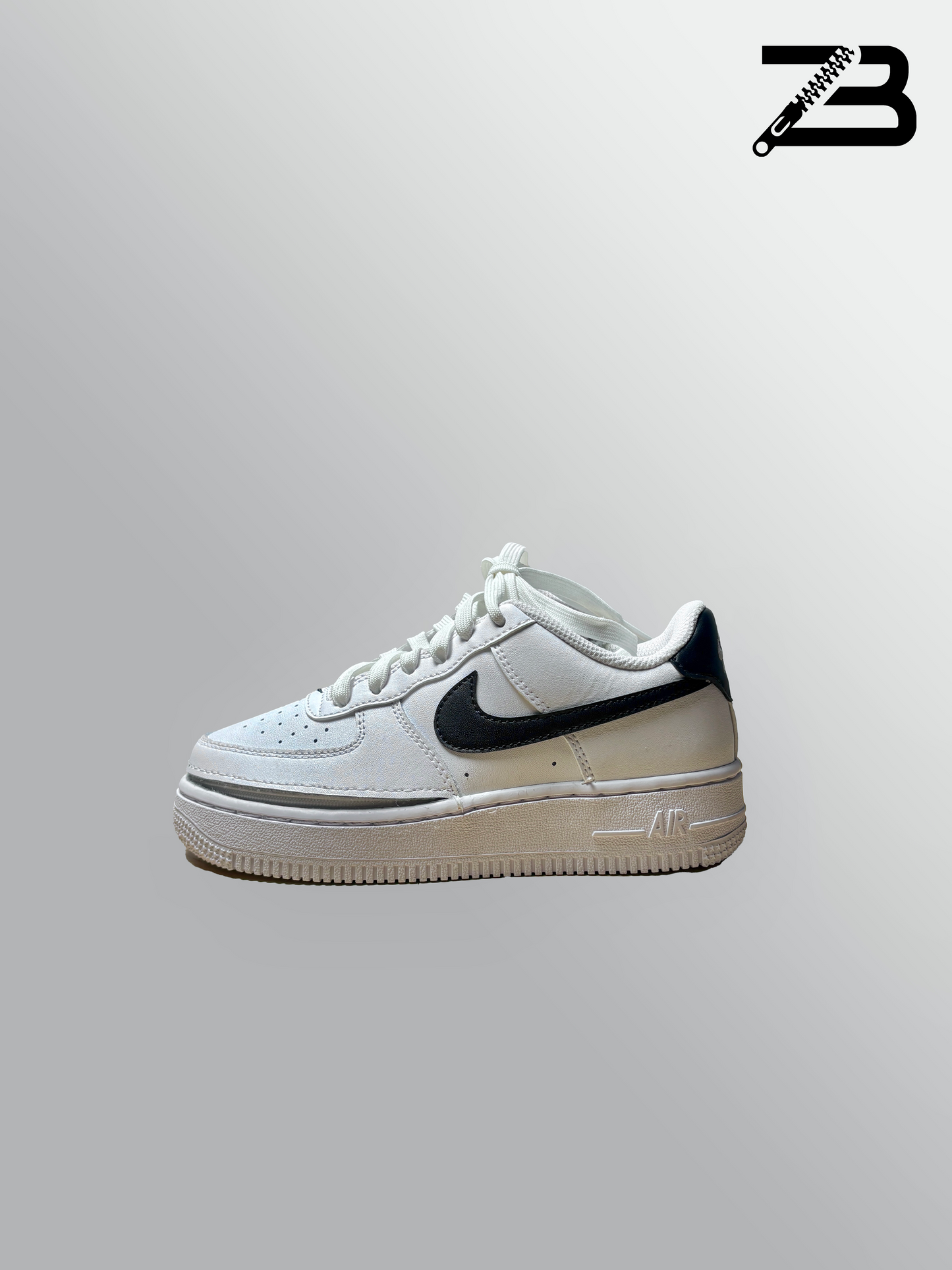 White nike shoe with a zipper on a gray background