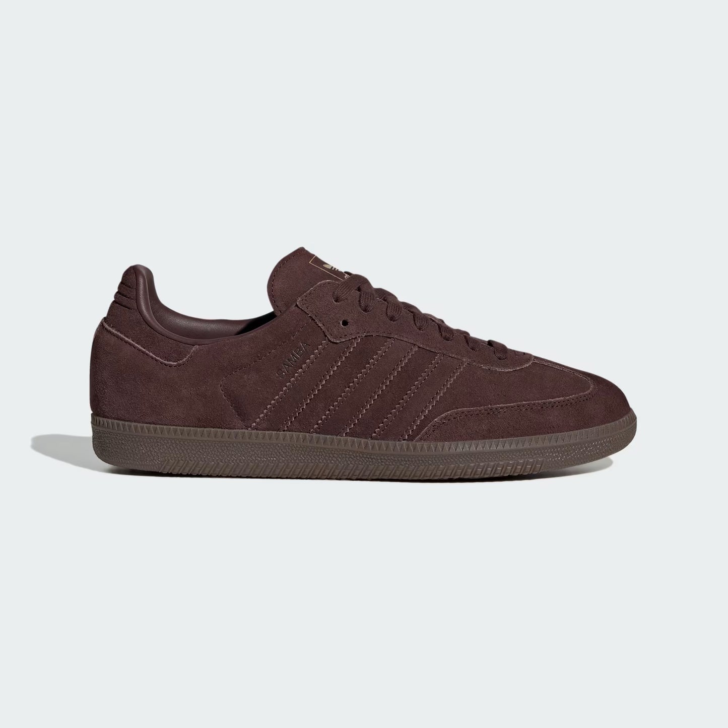 Brown Adidas sneaker on a light gray background