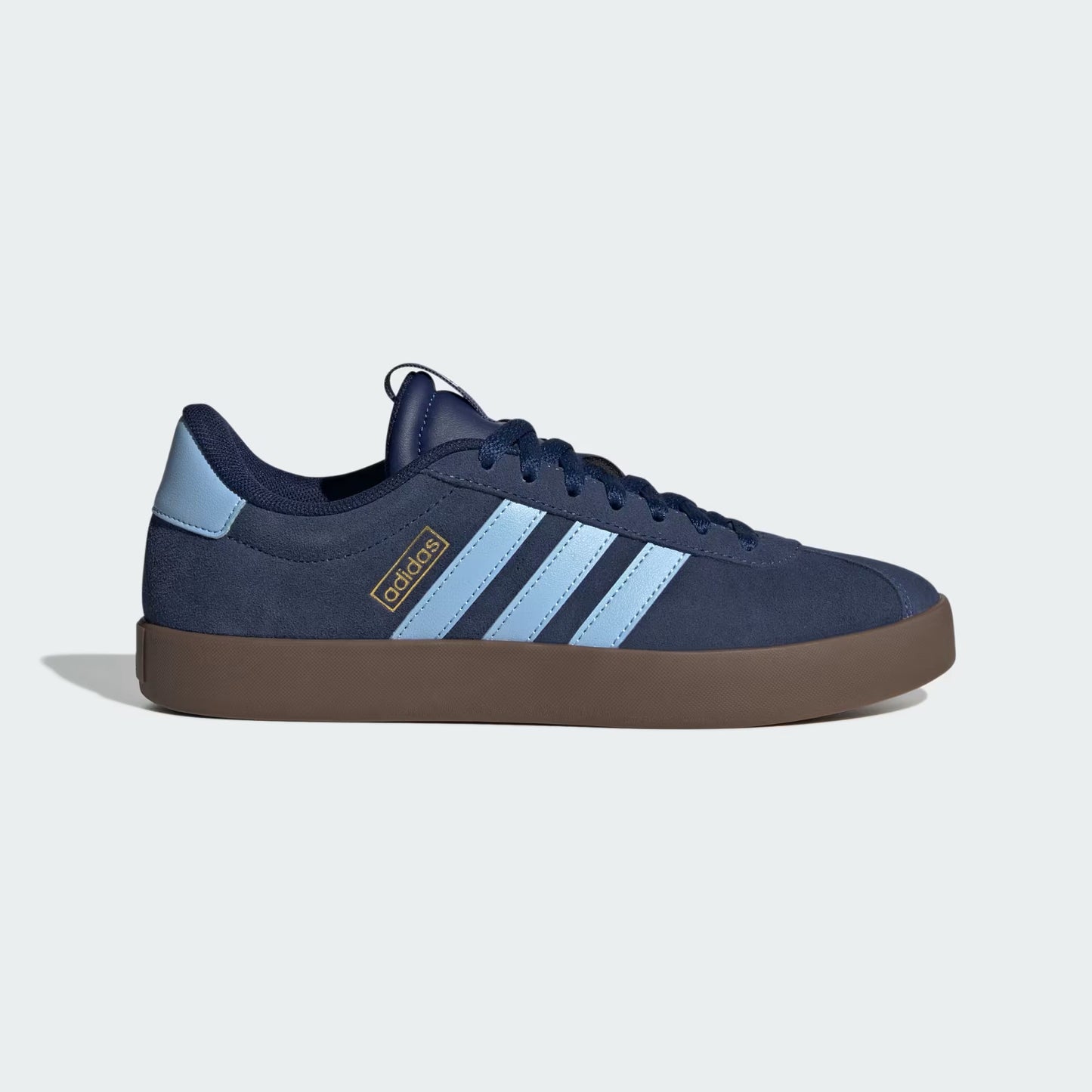 Navy blue sneaker with light blue stripes on a white background