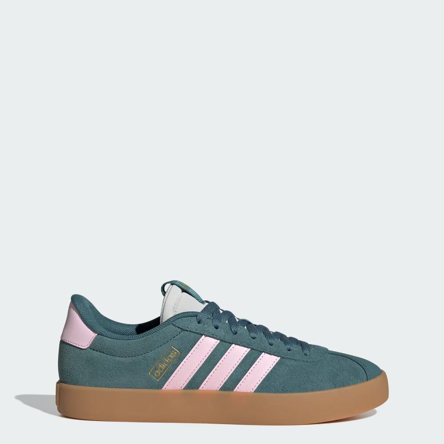Green Adidas sneaker with pink stripes on a white background