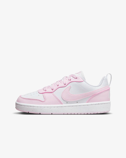 A pair of big kids' Nike Court Borough Low Recraft sneakers in white and pink color 