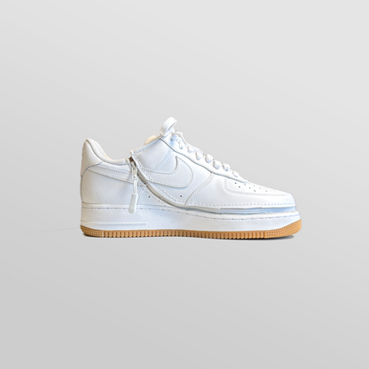 A pair of Men's Zipped Nike white shoes with a zipper.