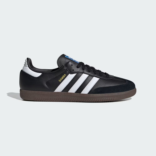 Black Adidas sneaker with white stripes on a light gray background