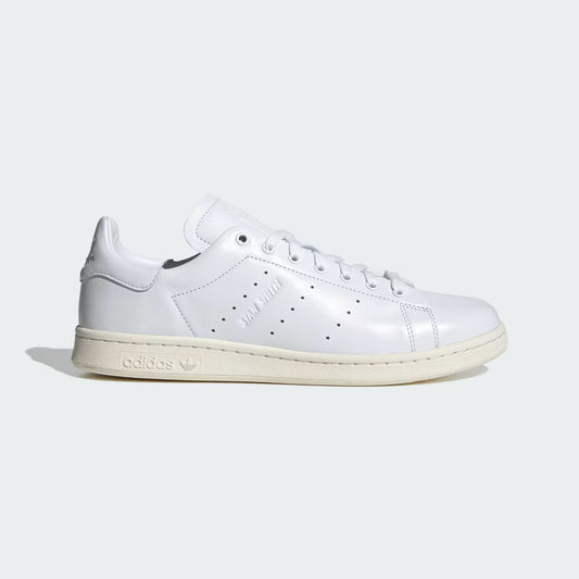 White Adidas sneaker on a light gray background