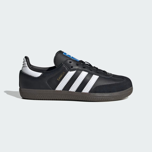 Black Adidas sneaker with white stripes on a light gray background