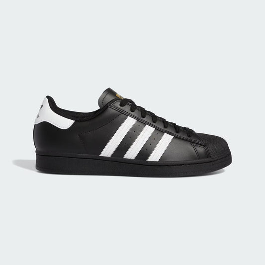 Black Adidas sneaker with white stripes on a light gray background